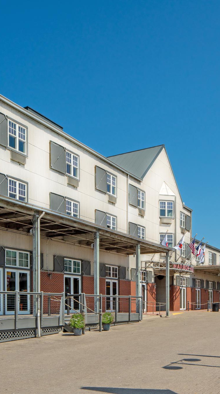 Exterior of Harbor House Hotel in Galveston, TX and Pier 21 sign