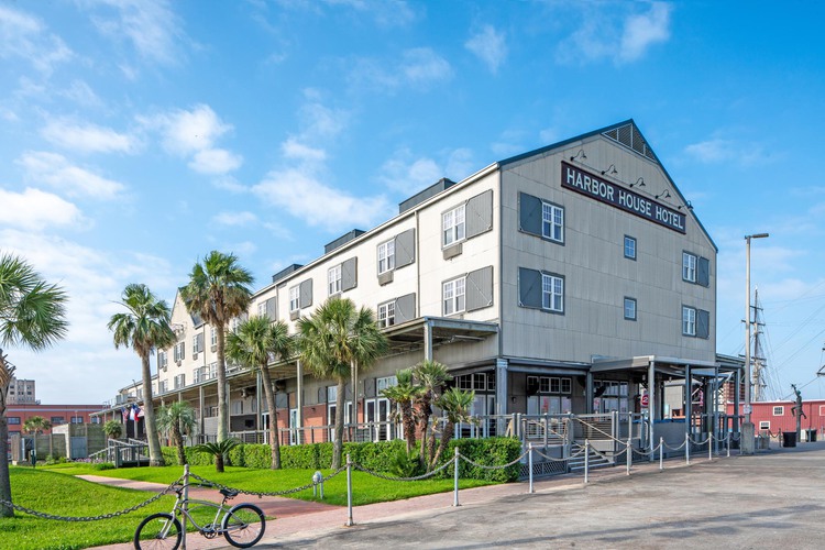 Exterior of Harbor House Hotel with bike in front